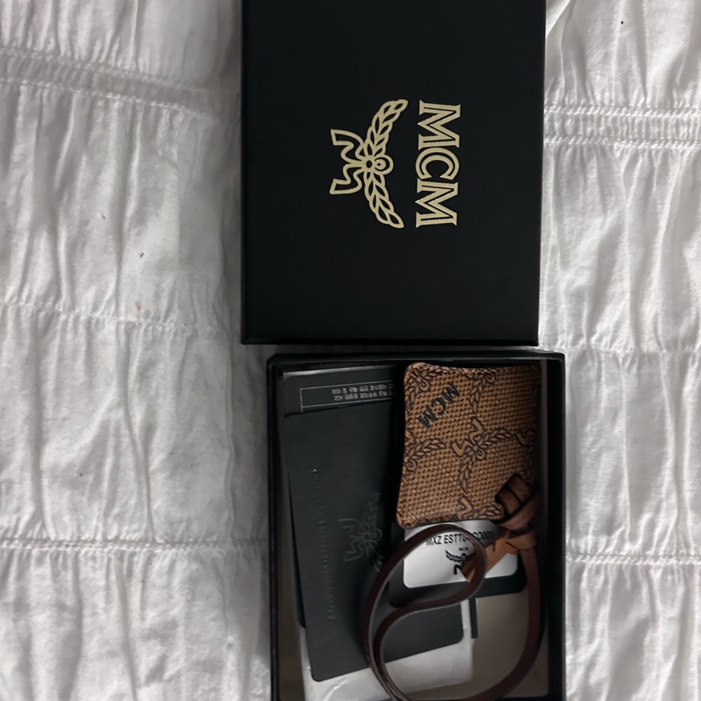 MCM Brown air tag holder and bag charm  with Signature Logo